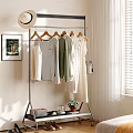 Stylish Clothing Rack With Hanging Clothes On Wooden Hangers And Potted Plant Books Near Window