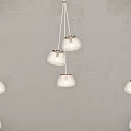 Multiple Modern White Glass Pendant Lights Hanging on Gray Interior Wall 3d model
