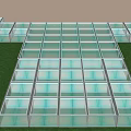 Transparent Glass Floor Structure on Green Grass Lawn with Metal Frame and Neatly Arranged Panels