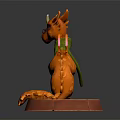 Orange Dragon Figure With Green Scarf And Glasses Sitting On Red Base
