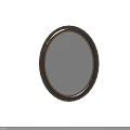 Oval Mirror With Gold And Black Frame Reflecting Bedroom Scene With Bedside Table And Vase