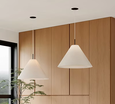Modern Interior With White Conical Fabric Pendant Lights Above Wooden Cabinets And Plant 3d model