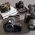 Vintage and Modern Digital Cameras Including Canon Nikon DSLR Models On Books