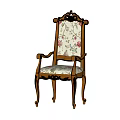Vintage Carved Wooden Armchair With Floral Fabric Upholstery And Decorative Design