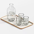 Transparent Glass Cups And Carafes Of Different Sizes On Wooden Trays For Drinking