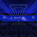 Modern Conference Stage Design With Blue Lighting Large Screens And Arranged Seats Setup