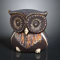 Handcrafted Brown Ceramic Owl Figurine With Intricate Eye Details And Decorative Feather Patterns