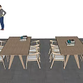 Outdoor Wooden Desks With Books And Chairs Under Blue Sky And White Clouds