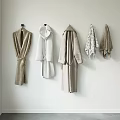 Soft Absorbent Bathrobes And Towels Hanging On Wall For Daily Use