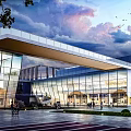 Modern School Building With Glass Facade Traditional Roof And Open Plaza For People Gathering