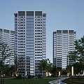 Modern High Rise Residential Buildings With Glass Facade Bright Windows Surrounding Trees And Street Lanterns