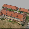 Traditional Connected Buildings With Red Roofs Arched Walkways And Courtyard Space