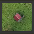Small Traditional Wooden Cabin With Red Roof On Stone Foundation In Green Grassy Area