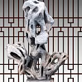 Natural Stone Sculpture With Porous Texture And Traditional Wooden Lattice
