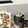 Glass Jar With Red Candies Paper Coffee Bag And Black Mugs With Wooden Lids