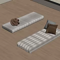 Beige Padded Floor Mats With Knitted Item And Cushions On Wooden Floor
