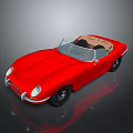 Red Jaguar Convertible Sports Car With Open Top And Shiny Exterior Design