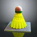 Yellow Badminton Shuttlecock Equipment With White Green Cork Top On Gray Base
