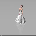 Woman In Strapless White Wedding Dress With Flower Hair Accessory On Gray Background