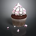 Chocolate Cupcake With White Frosting And Pink White Sprinkles On Black Background