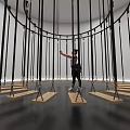 Art Installation With Circular Black Ropes Wooden Platforms And Visitor Interaction