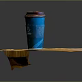 Green Coffee Cup With Brown Lid On Wooden Table Surface