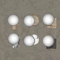 Modern Decorative Wall Sconces With White Spherical Shades And Various Base Colors On Beige Wall