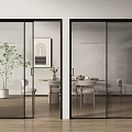 Modern Black Frame Glass Sliding Doors Interior With Dining Table And Plant