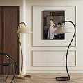 Golden And Black Modern Floor Lamps In Interior With Wall Art And Chair