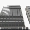 Modern Tall Office Building Exterior With Glass Curtain Walls And Large Windows