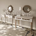 White Vanities With Gold Legs And Round Mirrors Featuring Vases Lamps And Decorative Items