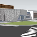 Modern Commercial Complex With Geometric Facade Green Lawn And Street Entrance