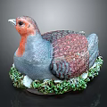 Detailed Bird Sculpture With Red Gray Brown Feathers Green Base And Eggs