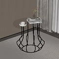 Modern Round Glass Top Side Table With Black Metal Frame And Decorative Items