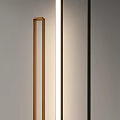 Modern Slim Floor Lamp With Metallic Design And Warm Lighting In Minimalist Interior