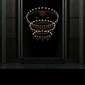 Golden Multi Tiered Modern Chandelier Hanging In Luxurious Dark Wall Interior