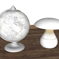 Globe And Mushroom Shaped Table Lamps On Wooden Table With Warm Illumination