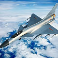 Modern Fighter Jet Flying Over Clouds With Missiles And Military Insignia