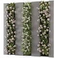 Lush Vertical Green Wall Design With White Flowers And Gray Backdrop