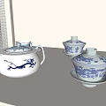 Traditional Blue and White Tea Set with Teapot Cups and Saucers on Tabletop