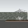 Building Exterior Wall Green Textured Stone With Wooden Deck White Table Chairs And Sunshade