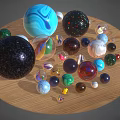 Assorted Colorful Glass Marbles With Diverse Patterns and Textures On Wooden Surface