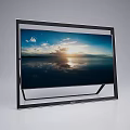 Modern Television With Black Frame Stand Showing Sunset Seaview Cloudy Sky And Sunlight Reflection