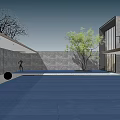 Modern Garden Landscape With Blue Paved Ground Green Tree Gray Stone Wall And Modern Building