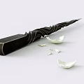 Black Weapon With Wavy Decorative Design And Broken White Ceramic Pieces Nearby