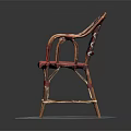 Red Wicker Chair With Patterned Backrest Curved Armrests And Metal Frame On Round Gray Mat