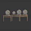Large And Small Industrial Metal Storage Tanks Placed On Rustic Metal Stands