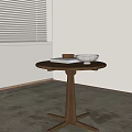 Modern Wooden Round Side Table With Cross Base Featuring Books And Bowls