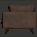 Brown Sectional Sofa with Orange Patterned Cushions and Wooden Legs in Modern Dark Setting