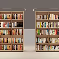 Two Light Wooden Bookcases With Multiple Shelves Filled With Colorful Books
